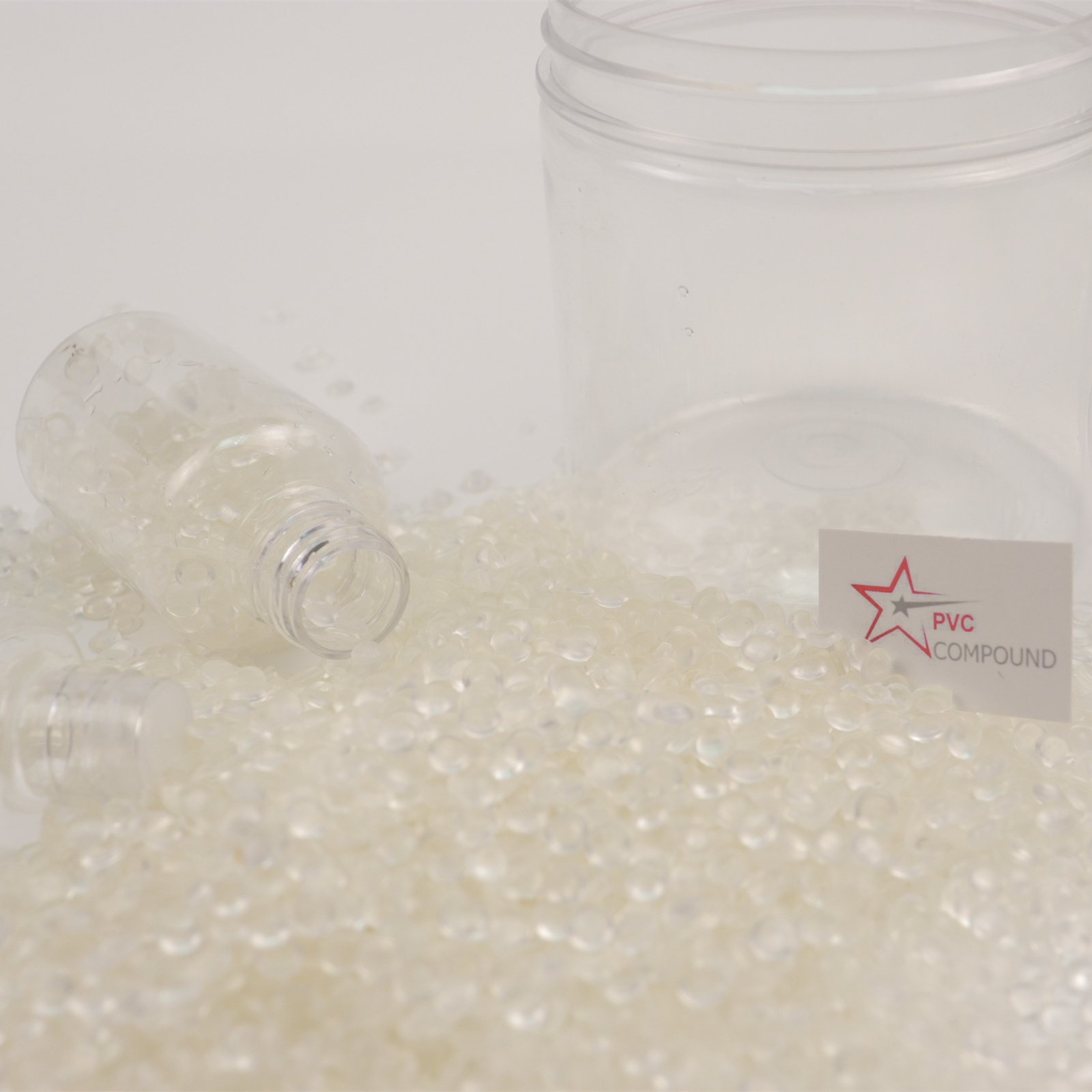 A collection of products made from rigid PVC like pipes, window frames, and bottles